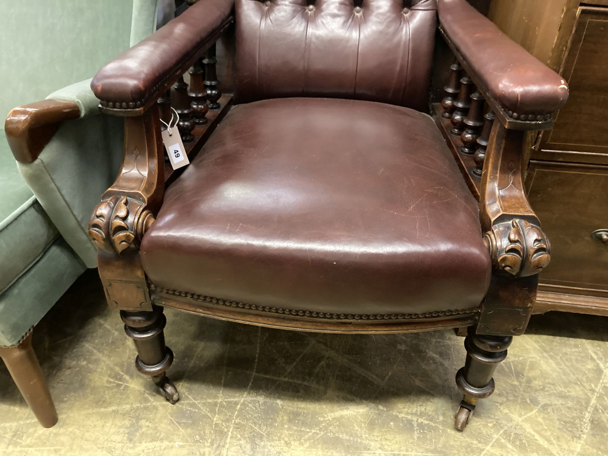 An early Victorian burgundy leather library chair, width 68cm, depth 80cm, height 98cm